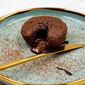 Indulge in a rich chocolate lava cake with molten center, served on a stylish plate.